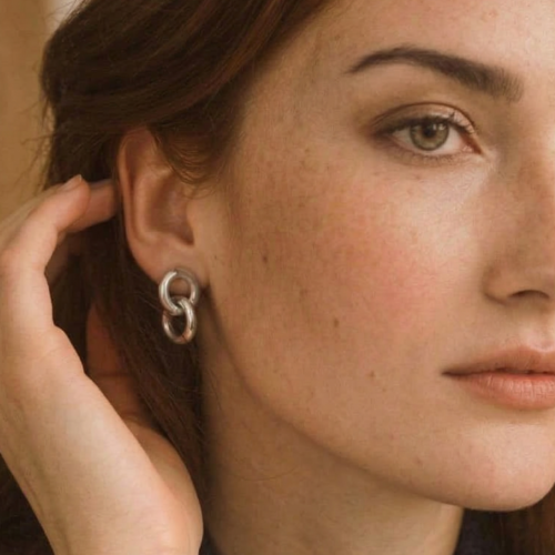 Sidabro spalvos kabantys auskarai